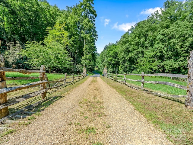 view of street featuring a view of trees and a rural view