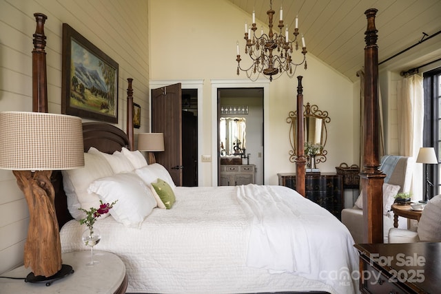 bedroom featuring an inviting chandelier and vaulted ceiling