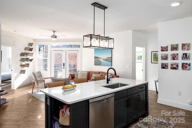 55 S Market St Unit 101, Asheville, NC 28801 - kitchen with stainless steel dishwasher, open floor plan, light countertops, and a sink