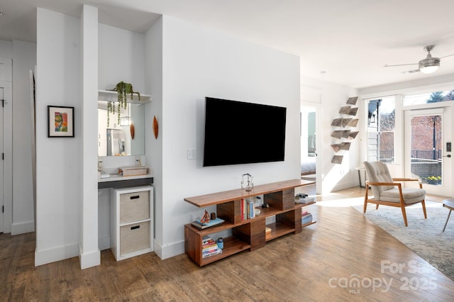 55 S Market St Unit 101, Asheville, NC 28801 - living room with ceiling fan, baseboards, and wood finished floors