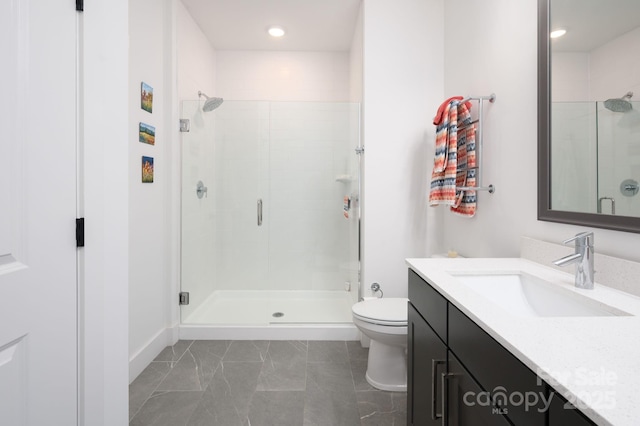 55 S Market St Unit 101, Asheville, NC 28801 - full bathroom featuring toilet, a shower stall, recessed lighting, vanity, and marble finish floor