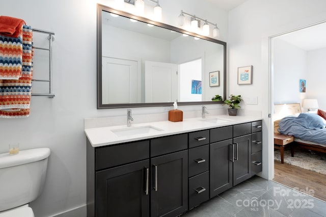 55 S Market St Unit 101, Asheville, NC 28801 - bathroom featuring connected bathroom, double vanity, a sink, and toilet