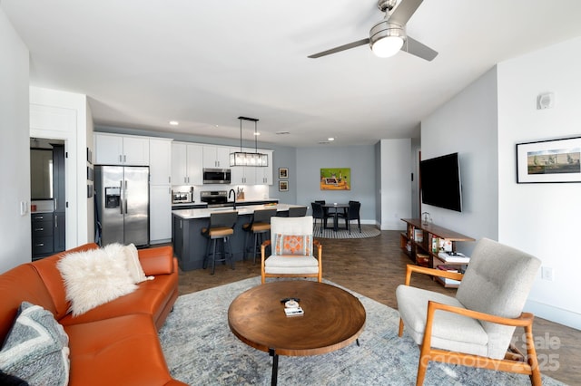 55 S Market St Unit 101, Asheville, NC 28801 - living room featuring recessed lighting, baseboards, a ceiling fan, and wood finished floors