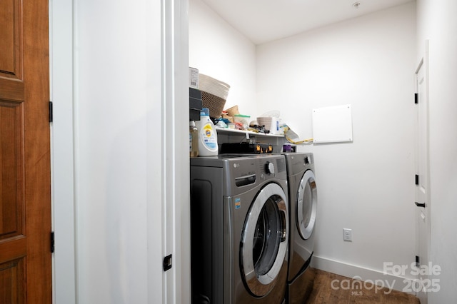 55 S Market St Unit 101, Asheville, NC 28801 - laundry area featuring laundry area, wood finished floors, baseboards, and washing machine and dryer