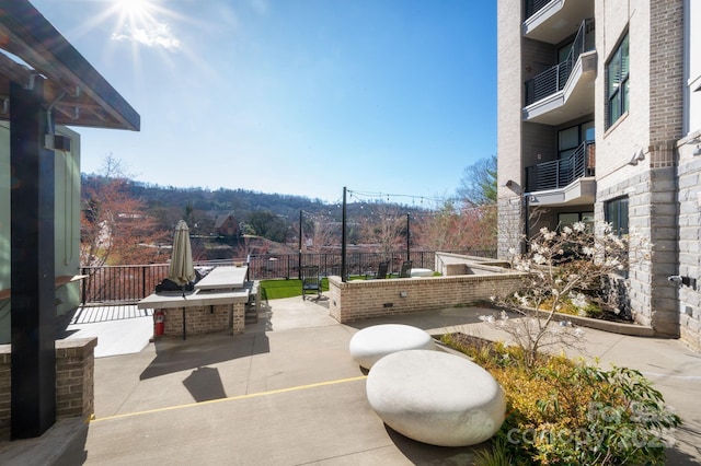 55 S Market St Unit 101, Asheville, NC 28801 - view of patio featuring fence and an outdoor kitchen