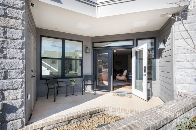 55 S Market St Unit 101, Asheville, NC 28801 - view of exterior entry with visible vents and stone siding