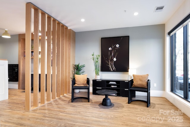 55 S Market St Unit 101, Asheville, NC 28801 - sitting room featuring recessed lighting, visible vents, and wood finished floors