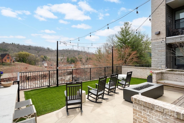 55 S Market St Unit 101, Asheville, NC 28801 - view of patio with an outdoor fire pit and fence