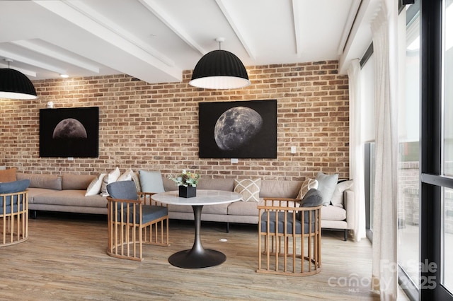 55 S Market St Unit 101, Asheville, NC 28801 - living room with brick wall and wood finished floors