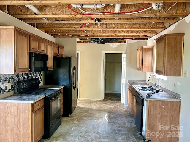 2752 Bramble Ridge Ct, Charlotte, NC 28215 - kitchen with tasteful backsplash, a sink, black appliances, brown cabinets, and concrete flooring