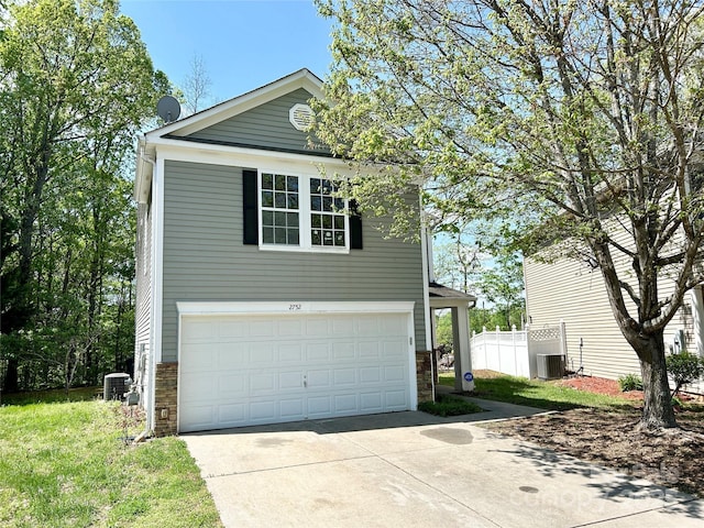 2752 Bramble Ridge Ct, Charlotte, NC 28215 - view of front of house with cooling unit, driveway, stone siding, and fence