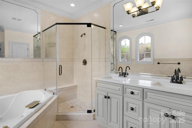 bathroom featuring a stall shower, visible vents, ornamental molding, and a sink