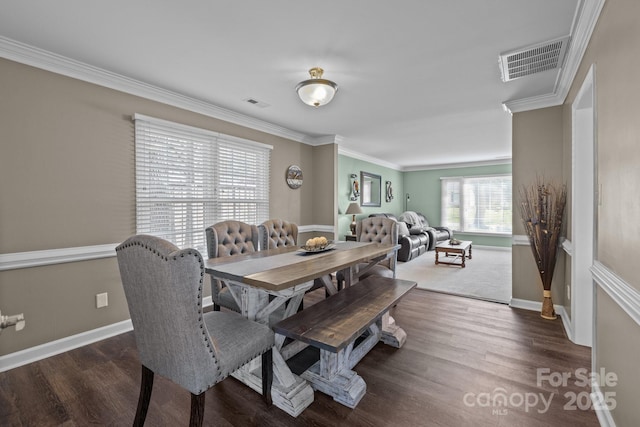 2439 Heathershire Ln, Matthews, NC 28105 - dining area featuring wood finished floors, crown molding, and baseboards