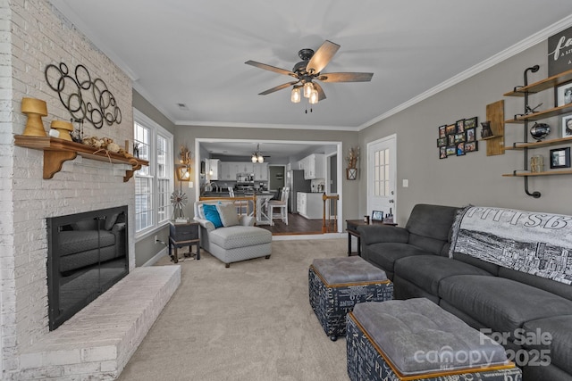 2439 Heathershire Ln, Matthews, NC 28105 - living area with crown molding, ceiling fan, light carpet, a fireplace, and baseboards