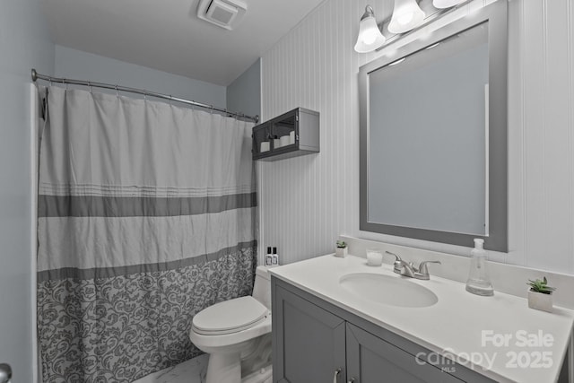 2439 Heathershire Ln, Matthews, NC 28105 - bathroom featuring marble look tile flooring, toilet, vanity, and a shower with curtain