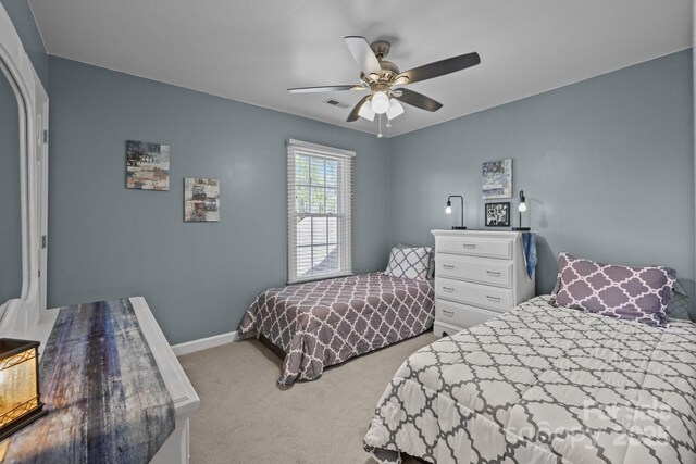 2439 Heathershire Ln, Matthews, NC 28105 - bedroom with carpet, baseboards, and a ceiling fan