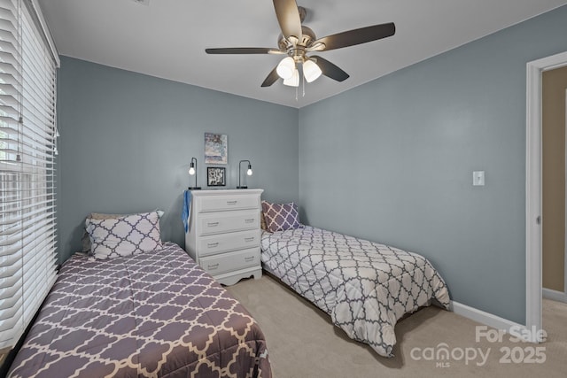 2439 Heathershire Ln, Matthews, NC 28105 - bedroom with light carpet, ceiling fan, and baseboards
