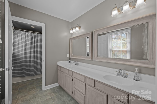2439 Heathershire Ln, Matthews, NC 28105 - bathroom featuring double vanity, baseboards, and curtained shower