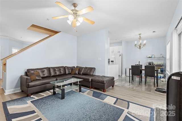 1386 21st Ave NE, Hickory, NC 28601 - living area featuring wood finished floors, a chandelier, ceiling fan, and baseboards