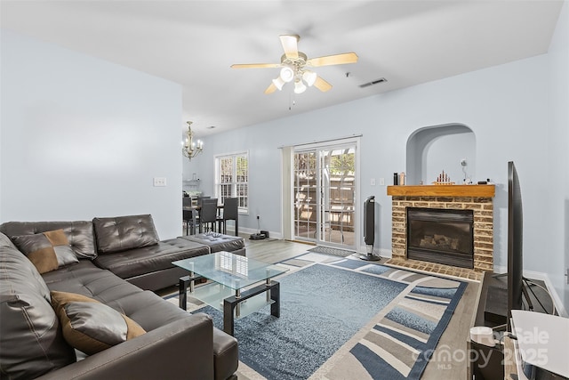 1386 21st Ave NE, Hickory, NC 28601 - living area featuring a ceiling fan, a fireplace, wood finished floors, a chandelier, and baseboards