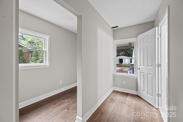 1801 Weststone Dr, Charlotte, NC 28208 - hallway featuring baseboards and wood finished floors