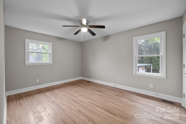 1801 Weststone Dr, Charlotte, NC 28208 - unfurnished room with visible vents, baseboards, a ceiling fan, and wood finished floors