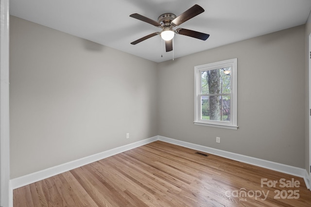 1801 Weststone Dr, Charlotte, NC 28208 - spare room with visible vents, baseboards, light wood-type flooring, and a ceiling fan