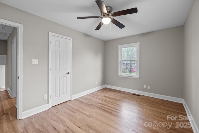 1801 Weststone Dr, Charlotte, NC 28208 - unfurnished bedroom featuring light wood-style flooring, baseboards, and a ceiling fan