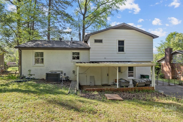 1801 Weststone Dr, Charlotte, NC 28208 - back of property with a yard, fence, cooling unit, a patio, and brick siding
