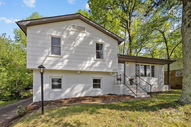 1801 Weststone Dr, Charlotte, NC 28208 - back of house with a yard and brick siding
