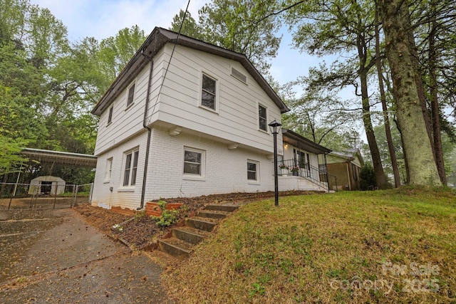 1801 Weststone Dr, Charlotte, NC 28208 - view of side of property with a yard and brick siding