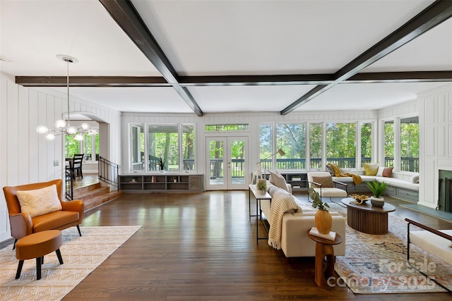sunroom featuring an inviting chandelier, french doors, beamed ceiling, and coffered ceiling