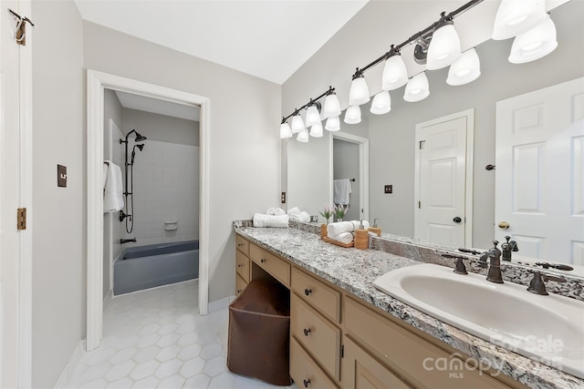 full bathroom with shower / tub combination, tile patterned floors, vanity, and baseboards