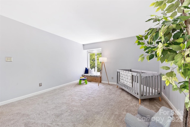 bedroom featuring baseboards and carpet