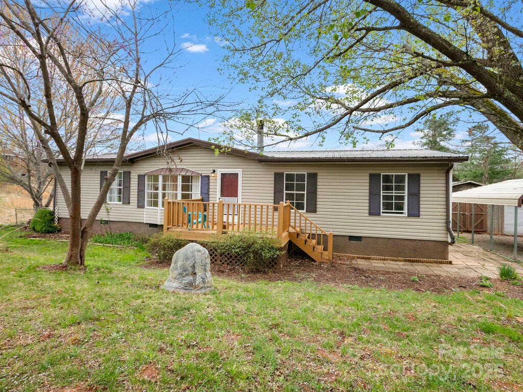 10 Clover Brook Dr, Weaverville, NC 28787 - back of property featuring a yard, a detached carport, crawl space, and a deck