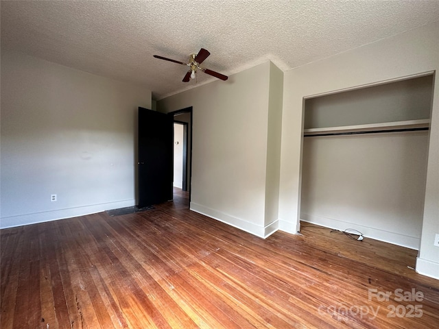 31 Hildebrand St Unit 1 & 154, Asheville, NC 28801 - unfurnished bedroom with baseboards, a textured ceiling, hardwood / wood-style flooring, ceiling fan, and a closet