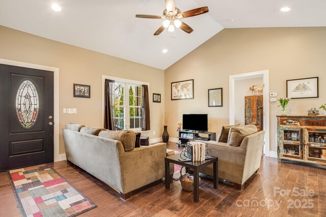 living area featuring ceiling fan, wood finished floors, vaulted ceiling, and recessed lighting