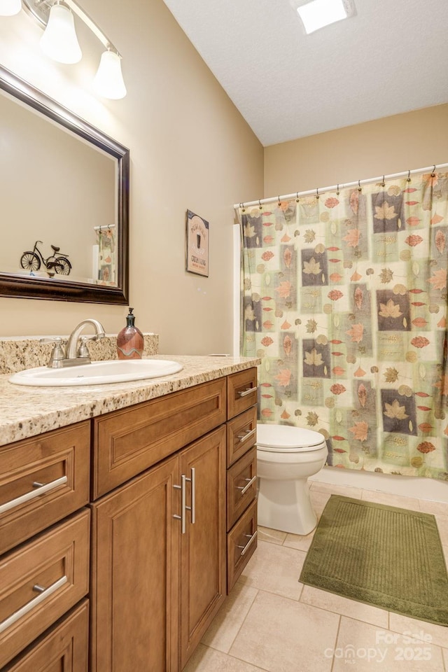 full bathroom with tile patterned flooring, vanity, and toilet