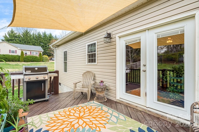 wooden terrace featuring area for grilling