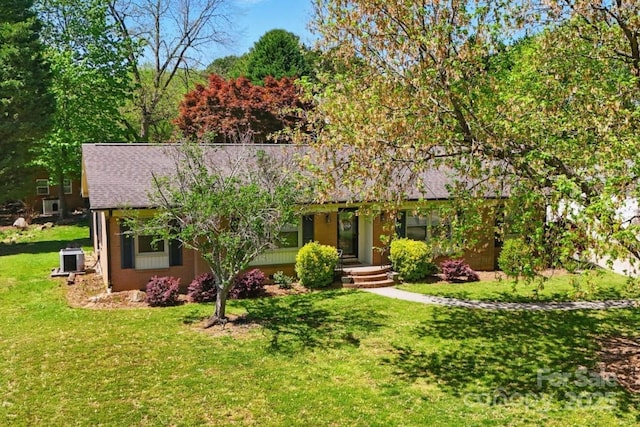 110 Tanglewood Dr, Kannapolis, NC 28081 - single story home featuring roof with shingles, a front lawn, and central AC