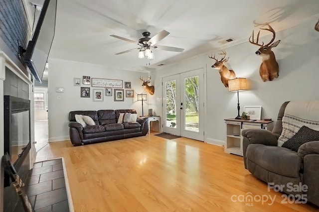 110 Tanglewood Dr, Kannapolis, NC 28081 - living area featuring french doors, a healthy amount of sunlight, ceiling fan, and wood finished floors