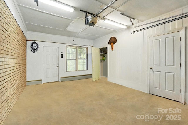 110 Tanglewood Dr, Kannapolis, NC 28081 - garage featuring wooden walls, a baseboard radiator, and a garage door opener
