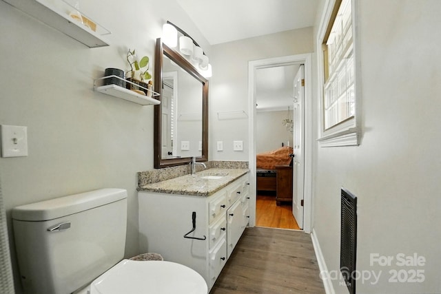 110 Tanglewood Dr, Kannapolis, NC 28081 - bathroom featuring connected bathroom, vanity, visible vents, toilet, and wood finished floors