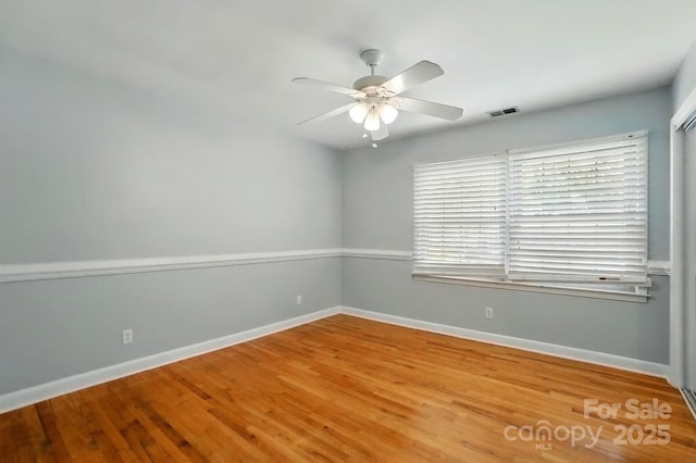110 Tanglewood Dr, Kannapolis, NC 28081 - empty room with visible vents, baseboards, a ceiling fan, and wood finished floors