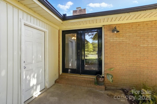 110 Tanglewood Dr, Kannapolis, NC 28081 - doorway to property featuring brick siding and a chimney