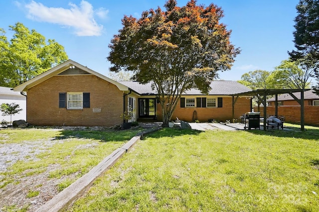110 Tanglewood Dr, Kannapolis, NC 28081 - view of front of property featuring a patio area, brick siding, fence, and a front lawn
