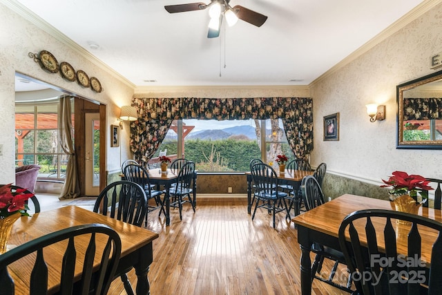 142 Country Club Dr, Waynesville, NC 28786 - dining area featuring wood-type flooring, a wealth of natural light, and crown molding