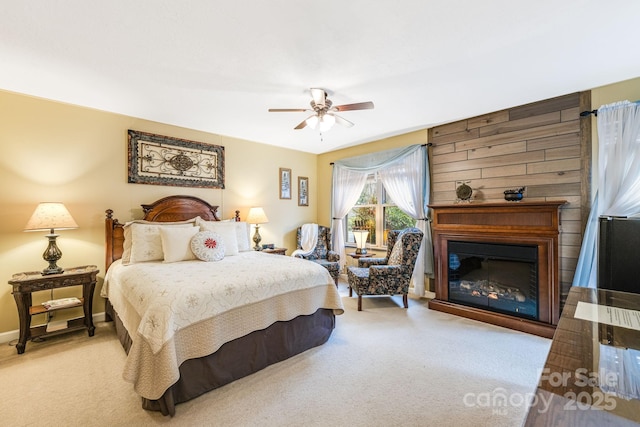142 Country Club Dr, Waynesville, NC 28786 - carpeted bedroom featuring ceiling fan and a large fireplace