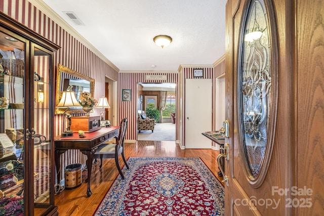 142 Country Club Dr, Waynesville, NC 28786 - entryway with ornamental molding, wood finished floors, and visible vents