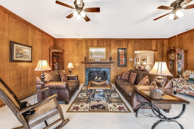 142 Country Club Dr, Waynesville, NC 28786 - carpeted living room featuring a fireplace, ornamental molding, wood walls, and ceiling fan